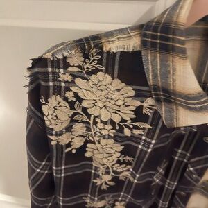 Beautiful embroidery on this Savanna Jane blouse.